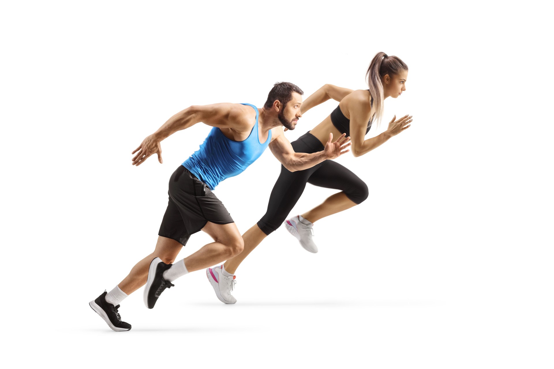 Full length profile shot of a male and female runners